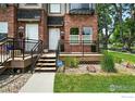 Inviting entryway to townhome with a cozy front porch and manicured landscaping at 4039 N Clay St, Denver, CO 80211