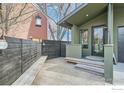 This peaceful side patio features wood benches and a modern design, perfect for outdoor relaxation at 456 W Sycamore Ct, Louisville, CO 80027