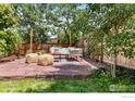 Relaxing backyard patio with stylish outdoor furniture, perfect for entertaining guests at 4594 Beach Ct, Denver, CO 80211