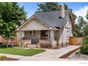 Attractive brick home with a manicured lawn, inviting curb appeal, and driveway at 4594 Beach Ct, Denver, CO 80211