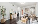 Inviting living room with fireplace, modern decor, and staircase at 85 Uinta Way # 605, Denver, CO 80230