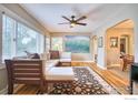 Inviting living room with hardwood floors, large windows, and stylish decor at 1233 Carolina Ave, Longmont, CO 80501