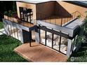 Modern home featuring a spacious deck, floor-to-ceiling windows, and stylish outdoor living spaces at 1265 Hartford Dr, Boulder, CO 80305