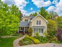 Beautiful home exterior featuring lush landscaping, a stone pathway, and well-maintained lawn at 1509 Poplar Ave, Boulder, CO 80304