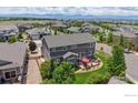 Aerial view of a backyard with a patio set, lawn, and wooden fence at 3891 W 149Th Ave, Broomfield, CO 80023