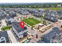 Overhead view showcasing the community and the unit's location near a green space and community park at 605 Promenade Dr, Superior, CO 80027