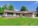 Inviting single-Gathering house with a manicured front lawn and classic design features at 633 S Galena St, Denver, CO 80247