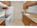 Efficient kitchen with stainless steel appliances, granite counters, and ample cabinet space at 6505 Kalua Rd # 104, Boulder, CO 80301