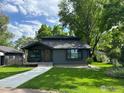 Charming home featuring a well-manicured lawn and inviting front porch at 7800 Hygiene Rd, Longmont, CO 80503