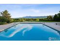 Inviting outdoor pool with mountain views, perfect for relaxation and recreation at 8000 N 41St St, Longmont, CO 80503