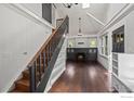 Light-filled living room with vaulted ceilings, hardwood floors, fireplace, and staircase at 1010 Euclid Ave, Boulder, CO 80302