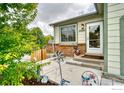 Inviting front entrance with tasteful decorations and lush greenery, offering a warm welcome at 10940 Utica Ct, Westminster, CO 80031