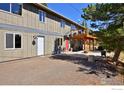 Exterior side of house with outdoor patio and seating at 223 Copperdale Ln, Golden, CO 80403