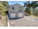 Two car garage of mountain home with new driveway and mountain views at 223 Copperdale Ln, Golden, CO 80403