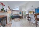 Bright living room with high ceilings, fireplace, large windows, and contemporary decor at 6076 Gunbarrel Ave # F, Boulder, CO 80301