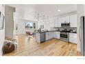 Modern kitchen with stainless steel appliances and an island at 751 Grandview Mdws Dr, Longmont, CO 80503