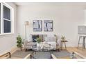 Cozy living room featuring stylish furniture, a patterned rug, and art on the wall at 751 Grandview Mdws Dr, Longmont, CO 80503