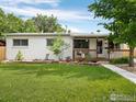 Charming single-story home with a well-maintained lawn and cozy front porch at 8190 Raleigh Pl, Westminster, CO 80031