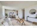 Open-concept living and dining area features stylish furnishings and ample natural light, perfect for modern living at 850 20Th St # 704, Boulder, CO 80302