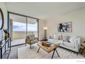 Cozy living room with a balcony view, comfortable seating, and elegant decor for relaxation at 850 20Th St # 704, Boulder, CO 80302