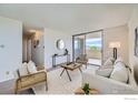 Inviting living room with balcony access, showcasing stylish furnishings and a serene atmosphere at 850 20Th St # 704, Boulder, CO 80302