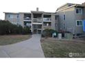 Condominium exterior with well-maintained landscaping and a walkway leading to the entrance at 20 S Boulder Cir # 2204, Boulder, CO 80303
