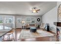 Inviting living room with abundant natural light, cozy fireplace, and stylish furnishings at 2132 Boise Ct, Longmont, CO 80504