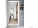 View into the home entryway highlighting the wood floors and interior design elements at 2201 Pearl St # 110, Boulder, CO 80302