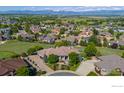 Gorgeous aerial view of a home nestled in a lush neighborhood with mountain views at 2378 Plumb Pl, Erie, CO 80516