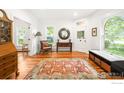 Inviting entryway boasts hardwood floors, ample natural light, and a cozy seating area at 446 Pearl St, Boulder, CO 80302