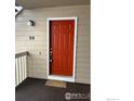 Exterior shot of the unit's front door, painted bright red, with the unit number clearly displayed at 4985 Twin Lakes Rd # 94, Boulder, CO 80301