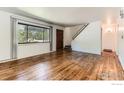 Bright and airy living room featuring hardwood floors, large windows, and a staircase at 510 S 46Th St, Boulder, CO 80305