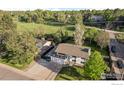 Aerial view of a lovely home with mature trees and a lush green lawn in a peaceful neighborhood at 794 W Elati Cir, Littleton, CO 80120