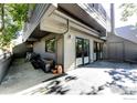 Lower level back patio has concrete pad and access to storage and back entrance at 812 Walnut St # D, Boulder, CO 80302