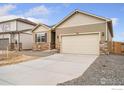 Charming single Gathering home featuring stone accents, two-car garage, and neutral colored siding at 874 Ledge St, Lochbuie, CO 80601