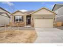 Charming single Gathering home featuring stone accents, two-car garage, and neutral colored siding at 874 Ledge St, Lochbuie, CO 80601