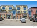Contemporary townhomes showcasing brick and stucco exteriors, street parking, and commercial spaces at 1200 Yarmouth Ave # 237, Boulder, CO 80304
