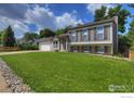 Charming two-story house with well-maintained lawn and a two car garage at 137 S Polk Ave, Louisville, CO 80027