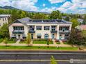 Multi-Gathering building with three floors, exterior is painted in light colors and offers private balconies at 1455 Yarmouth Ave # 211, Boulder, CO 80304