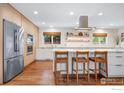 Bright kitchen with island, stainless steel appliances, and hardwood floors at 3490 16Th Cir, Boulder, CO 80304