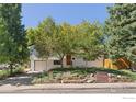 Well-maintained home with mature trees, brick landscaping, and attached garage at 3635 Buckeye Ct, Boulder, CO 80304