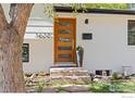 Stylish front door featuring modern glass panels and attractive landscaping at 3635 Buckeye Ct, Boulder, CO 80304