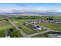 Expansive aerial view showcasing the property's location within a serene, green neighborhood at 505 Nesting Eagles Way, Berthoud, CO 80513