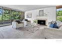 Inviting living room with a fireplace, comfortable seating, and large windows offering serene views at 525 13Th St, Boulder, CO 80302