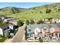 A neighborhood scene nestled against the backdrop of rolling green hills and blue skies at 5315 5Th St # A, Boulder, CO 80304