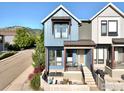 This townhome features a front patio, stairs leading up to the entrance, and a modern design at 5315 5Th St # A, Boulder, CO 80304