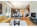 Inviting living room with hardwood floors, open layout, and a stylish staircase at 5315 5Th St # A, Boulder, CO 80304