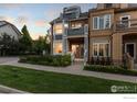 Well-manicured lawn and flowers accent this attractive multi-story townhouse with private entry at 555 Laramie Blvd, Boulder, CO 80304