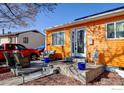 Inviting front porch with cozy seating and charming decorative accents at 7970 Wolff Ct, Westminster, CO 80030