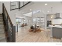 Bright, open-concept living space with high ceilings, modern finishes, and large windows for natural light and views at 9052 E 47Th Ave, Denver, CO 80238